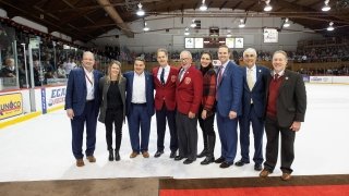 A photo of everyone being recognized on the ice.