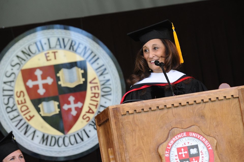 A photo of Susan Talve standing behind the podium as she addresses the class of 2014 during commencement.
