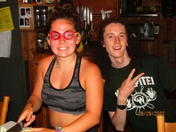 Arcadians Autumn and Finn work on dinner while bonding over onion-protective goggles.