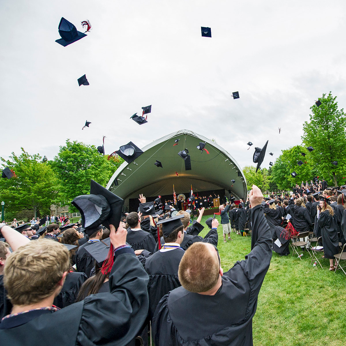 Graduates throwing caps in the air