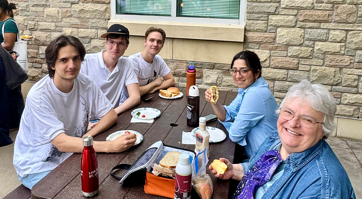 St. Lawrence students and faculty enjoying a barbecue outside Johnson Hall of Science