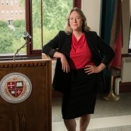 Allie Rowland poses next to St. Lawrence University podium