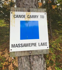 A trail marker indicating the canoe carry to Massawepie.