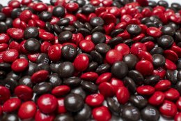 Up-close with a lot of red and brown M and Ms.