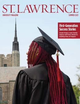 The Saint Lawrence University magazine summer 2023 cover features Sarath Novas, wearing graduation regalia, peers off into the distance. The Gunnsion Memorial Chapel is in the background.