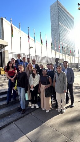 Group of students posing at the main entrance of the UN headquarters
