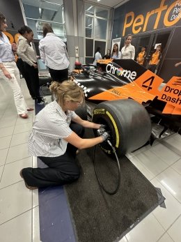 Cordelia Sherwood '26 replaces wheel on racecar