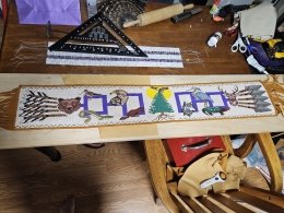 The Gathering of Nations, a stunning 42-inch beaded belt by Akwesasne Mohawk artists Kelly Tsieriwaiens Back and Tyson Karonhiahere Back from Fire Loom Creations.