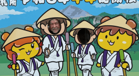 Dr. Mark MacWilliams posing with pilgrimage-themed characters during his summer 2026 trip to Japan
