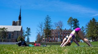 Students doing yoga in the Quad
