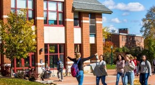 Students Greeting Each Other on Campus