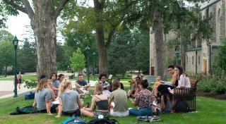 Faculty teaching class outside