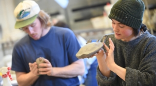 Students working in ceramics class