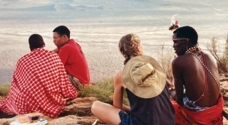 students and local on top of a mountain
