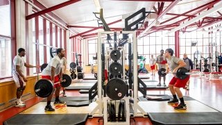 Athletes lifting weights