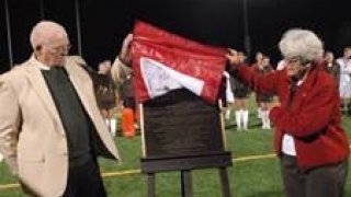 Don Leet and Dotty Hall unveil a plaque.