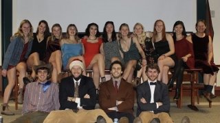 The residents of the Green House gather in formal attire for a group photo during an event in fall 2019.