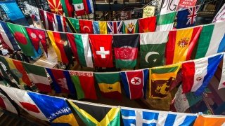 Sullivan Student Center decorated with flags representing several students' nationalities and heritage.