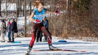 Lucy Hochshartner mid-stride during a Nordic ski competition.