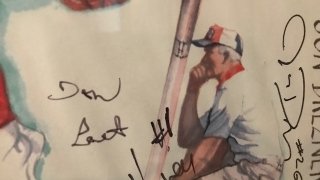 Section of a poster with drawing of Coach Leet and signatures.