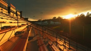 A glorious sun set over the empty bleachers overlooking athletic fields on the Saint Lawrence campus.