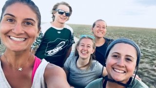 Five Saint Lawrence University students stand together for a photo. 