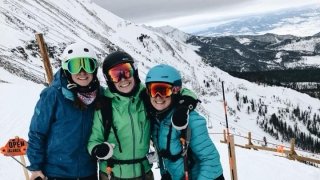 Olivia Hart, Monica Manning, and Kirsten Gehl skiing atop Big Sky, Montana.