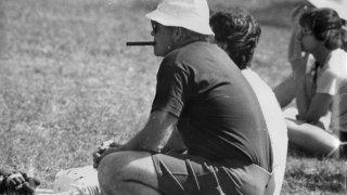 Don Leet squats on the sideline.