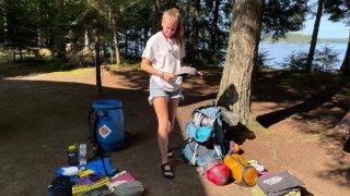 Figuring out what to pack in the canoe barrel for the expedition
