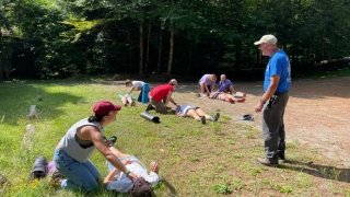 Practicing wilderness first aid.