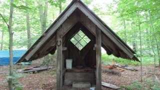 A private privy on Michael’s property, complete with detailed trim!