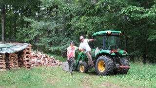 John and Kai posing on the tractor (not included: Kai’s rendition of Big Green Tractor).