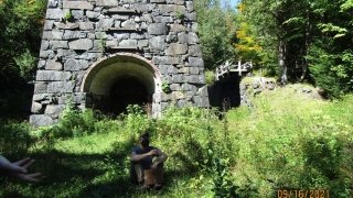 Professor Pete leads a discussion about the history of land-use during a field trip.