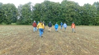 Arcadians chase after Mark Kimball at Essex Farm.
