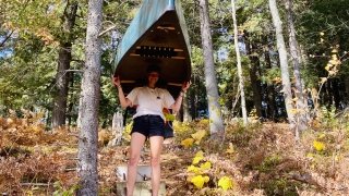 Sage carries the canoe beneath the autumn colors.