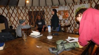 Arcadians discuss academics in the classroom yurt with a wood stove roaring.