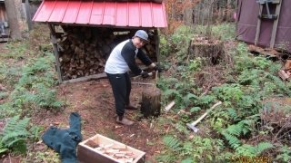 Cara chops kindling for the classroom yurt.