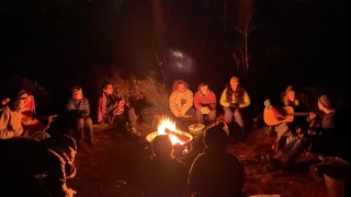 Sitting around the campfire listening to Caitlin Kelly.