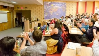 Emily Metzger presents research, to a lecture hall full of attendees, during the Festival of Scholarship at St. Lawrence University. 