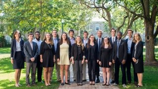 Several Saint Lawrence University students and two faculty members, who participated in the New York Fed challenge, gather on the quad. 