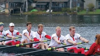 A photo of the men's rowing team in action.