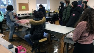 Artist Chloe Alexander welcomes some guests to the studio