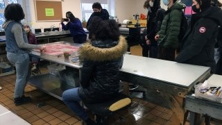 Artist Chloe Alexander welcomes some guests to the studio