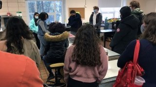 Artist Chloe Alexander welcomes some guests to the studio