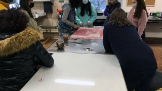 Artist Chloe Alexander welcomes some guests to the studio