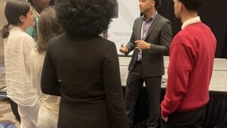 A group of Saint Lawrence students listen to a speaker at the American Association of Colleges &amp; Universities Conference on Diversity, Equity, and Student Success.