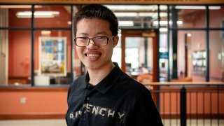 Headshot of Jonah Perry standing outside the Center for Career Excellence. 