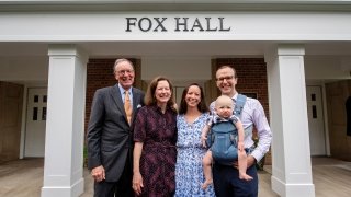 President Emeritus William Fox, Lynn Fox and their family outside the newly named &quot;Fox Hall&quot; building.