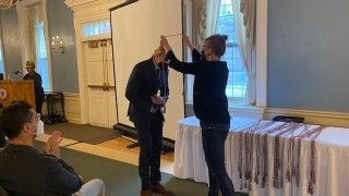 Student Receives Graduation Cords