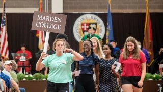 First-year students follow their Orientation Leader as they leave their Matriculation ceremony.
